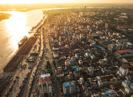Aerial  shot,view from the drone on the road junction and city of Yangon near Rangoon river at sunset colors ,Myanmarの写真素材