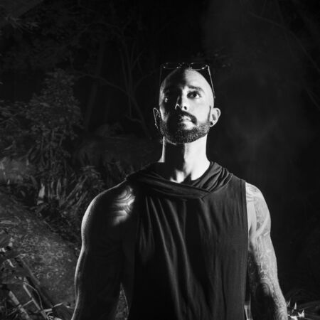 B/W male portrait at dark background