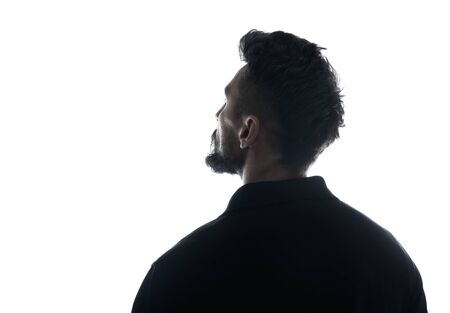 Silhouette of male person , back view back lit over white の写真素材