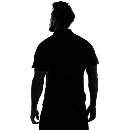 Silhouette of male person , back view back lit over white の写真素材