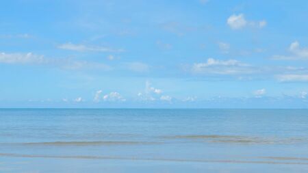Sky with clouds above the ocean, calm water surfaceの写真素材