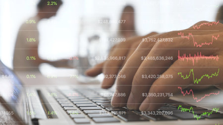Typing hands on laptop keyboard, moving on the screen crypto currency board newsの写真素材