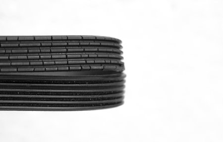 old and new timing belts comparison. Isolated car parts on white background. Copy space for carshop bannerの写真素材