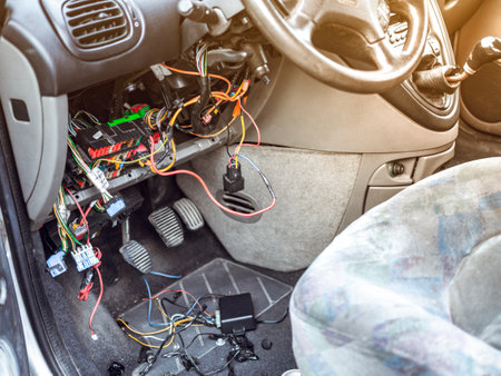 Repair stolen car. Thief bypass car alarm immobiliser. Intervention in wiringの写真素材
