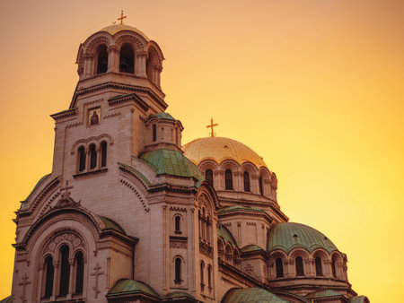 Christianity and Christian Easter concept. Golden domes of Christian church, Cathedral of Alexander Nevsky in Sofia at dawn isolated in the golden hourの写真素材