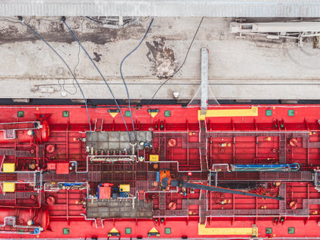 Vessel oil tanker close up top down view. Loading process of marine tanker