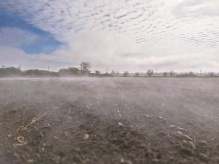 Misty Plowed Field at Dawn. camera flyover low above the groundの写真素材