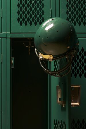 football helmets in locker roomの写真素材