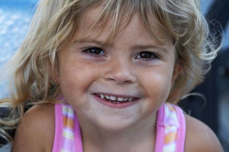 cute young girl smiling at the camera