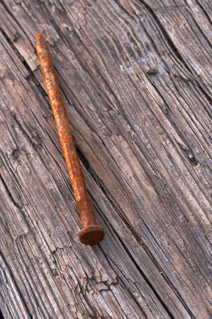 a macro picture of old wood and nailの写真素材