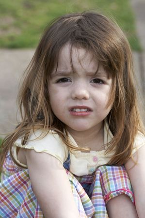 a cute little girl that is upset