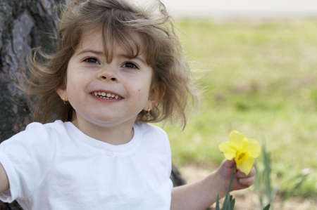 a cute little girl smiling at the cameraの写真素材