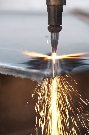 a close up of track torch burning steel