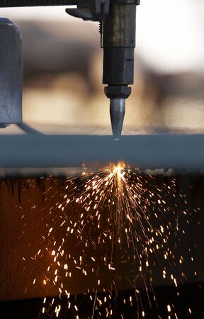 a close up of track torch burning steel