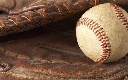 a macro of a baseball in glove