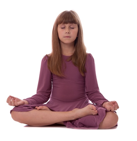 Girl sitting on floor meditating. Yoga. Lotus Position. の写真素材