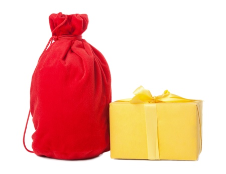 closed red christmas sack and yellow box, isolated white backgroundの写真素材
