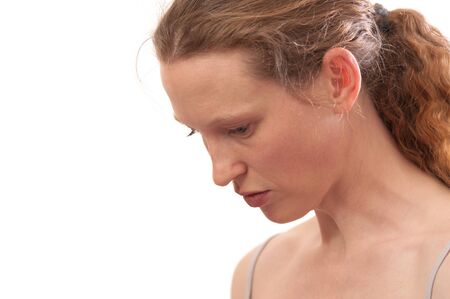 young woman looking downwards, isolated