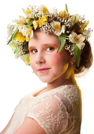 Portrait of a beautiful girl wearing flowers hat. Isolated white backgroundの写真素材
