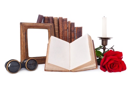 Still life with antique books and picture frames. Isolated on white.の写真素材