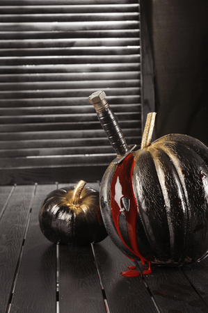 Black and white pumpkins. Home decoration for Halloween in the modern style. Vertical.の写真素材