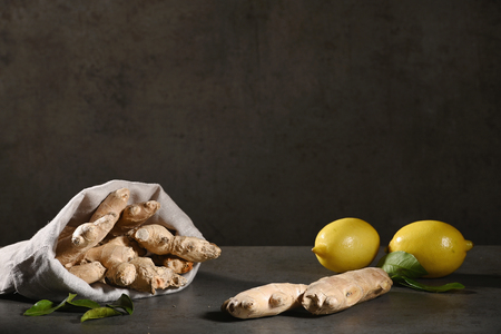Ginger and lemon. Ingredients for homemade lemonade on a dark background. Horizontalの写真素材