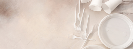 Plastic tableware on light background. Environmental protection. Secondary processing. The concept of zero waste.の写真素材