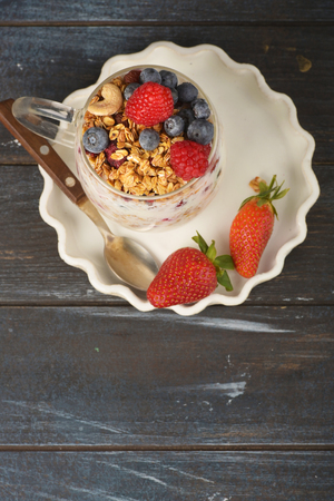Series about granola, berry and greek yogurt suitable for a healthy breakfast, snack or dessert.の写真素材