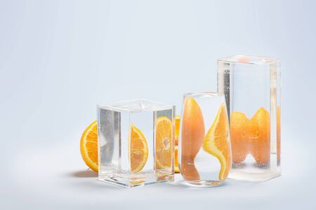 Perspective, fractured and skewed images of common foods as seen through vessels filled with water.