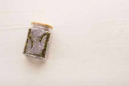 Beas in glass on a white textured background. Sustainable lifestyle concept, zero waste, eco friendly, plastic free items.の写真素材