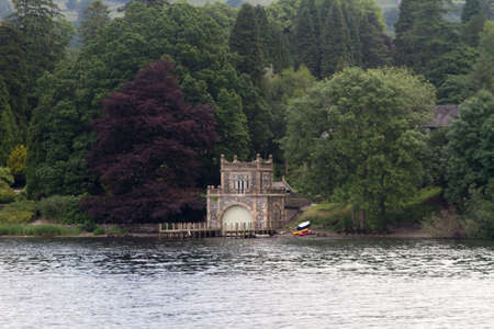 A small boat house on the side of the lake at windermereのeditorial素材