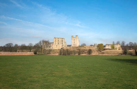 View of helmsley castle from the grass field