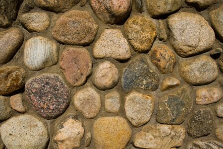 An architectual detail or a backround of a river stone wall.の写真素材