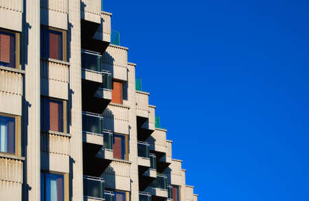 City house windows and a blue skyの写真素材