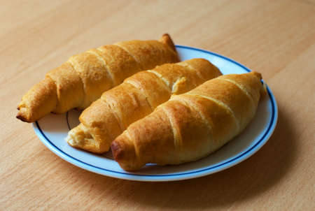 Home baked croissants on plateの写真素材