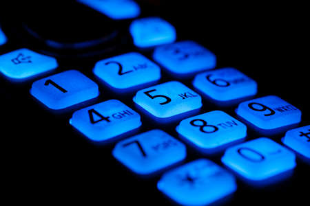 Phone buttons night blue backlight close-up macro shot, selective focusingの写真素材