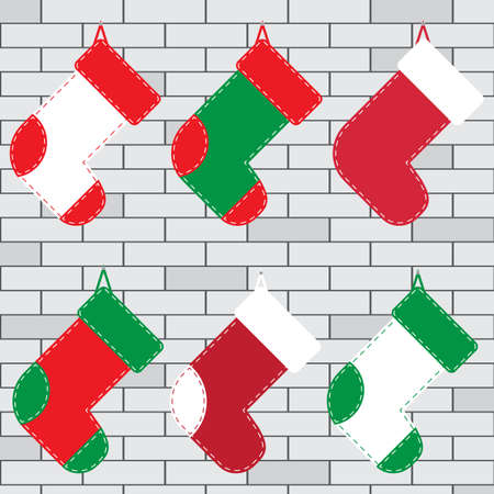 Set of christmas socks for gifts hanged on a brick wall, flat vector image.のイラスト素材