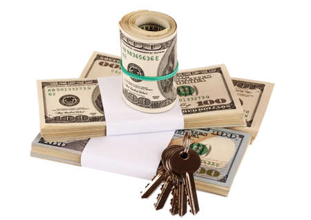 Bundle of US dollars and keys isolated on white, closeup, selective focusの写真素材