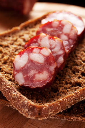 Rye bread sandwich with sausage close-up shotの写真素材