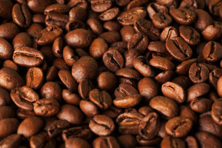 Roasted natural brown coffee beans closeup macro