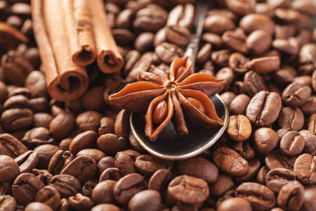 Star anise with cinnamon and roasted coffee beans closeup shot, selective focus