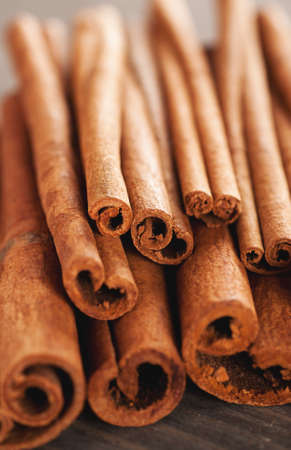 Closeup macro shot of cinnamon sticks, selective focus, verticalの写真素材