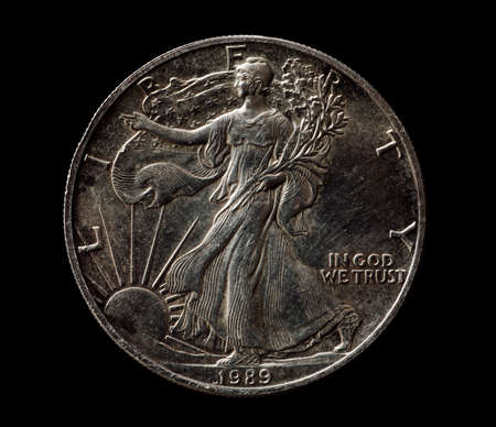 US silver liberty dollar isolated on black, closeup macro shotの写真素材