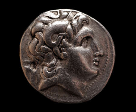 Ancient Greek silver coin of Lysimachus on a black background, closeup macro shot, selective focusの写真素材