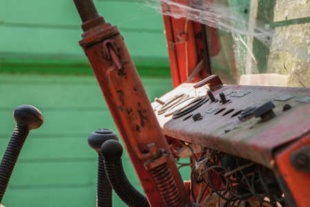 Old red metal dasboard with cintrols closeup shotの写真素材