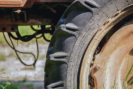 Big old tractor wheel, closeup shot, selective focusの写真素材