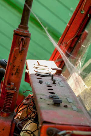 Old rusty dashboard with dust and spider web, vertical