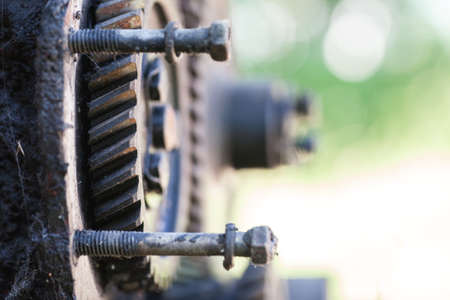Dirty gear with bolts, selective focus, copy spaceの写真素材