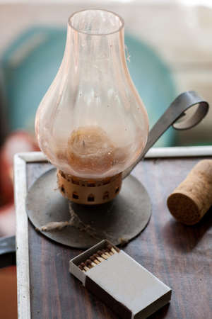Old shabby candle holder with matches, selective focus, verticalの写真素材