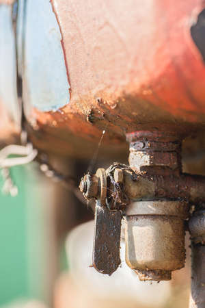 Dirty metal fuel tap, closeup shot selective focus